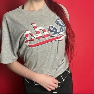 Grey tee with American flag themed  writing 🤍❤️​​​​​​​​​​​​​​​​​​​​​​​